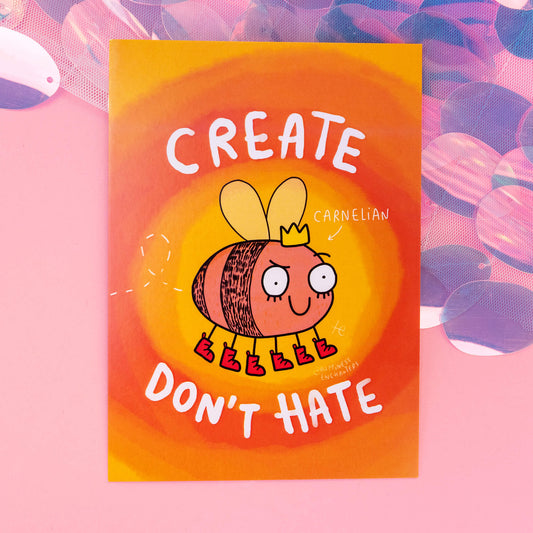 A whimsical Carnelian-themed postcard from 'Happiness Enchanters', featuring a cute, cartoon Carnelian crystal character in the form of a bee with a crown and boots, accompanied by the text 'Create, don't hate' on a vibrant orange and yellow swirly background. The postcard radiates a magical and playful vibe.