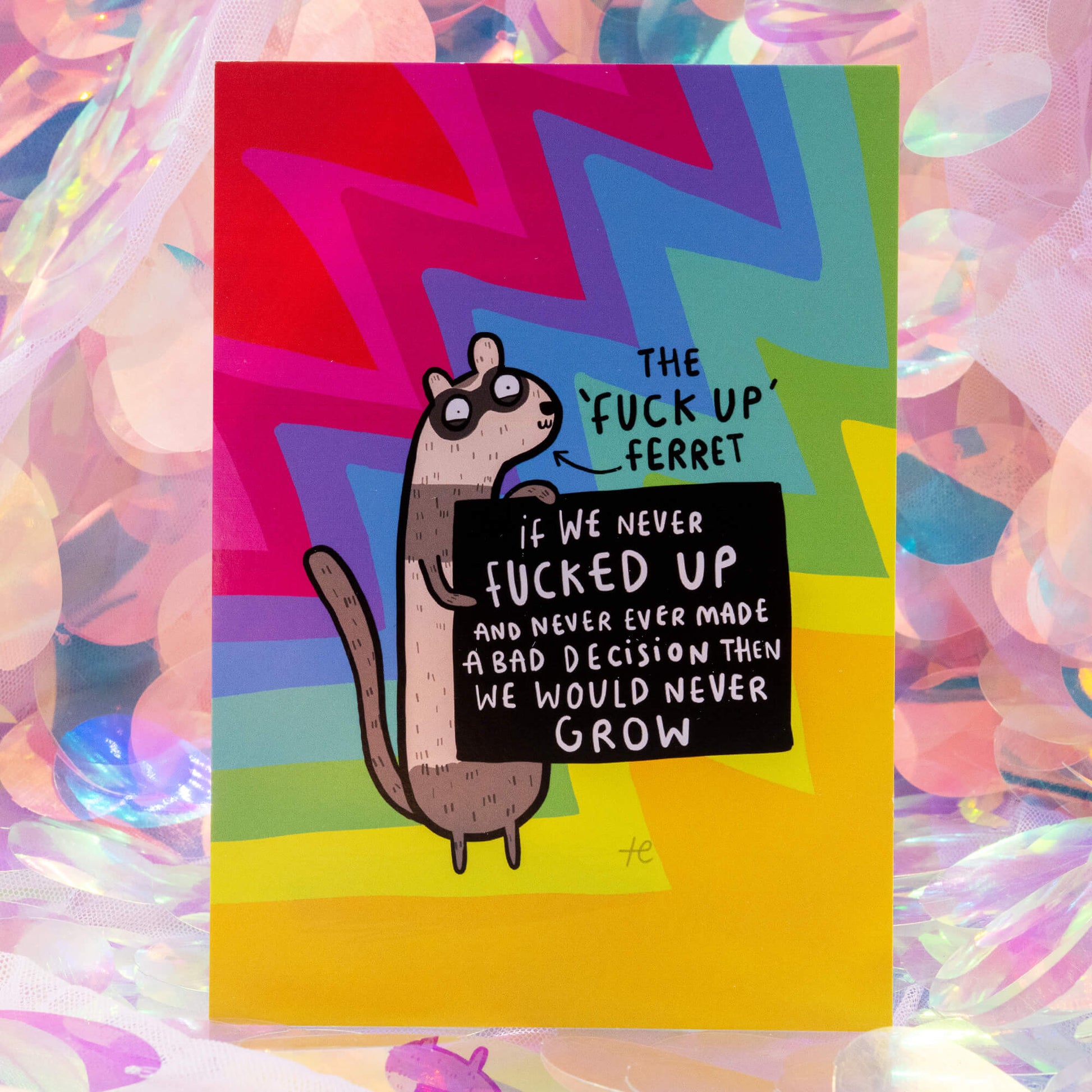 The ‘Fuck Up’ Ferret Postcard by Happiness Enchanters, shown against a pastel iridescent background. The cheerful rainbow design features an illustrated ferret spreading a message of self-growth and acceptance.