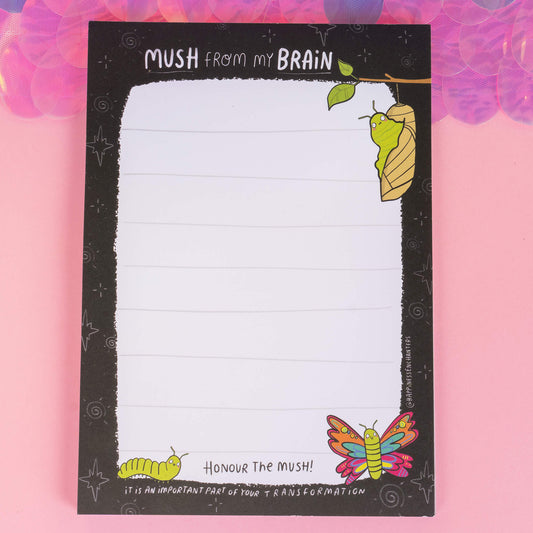 Full view of a whimsical notepad by Happiness Enchanters featuring a caterpillar, chrysalis, and butterfly illustration. The header reads “Mush from my Brain,” encouraging embracing transformation in your writing.