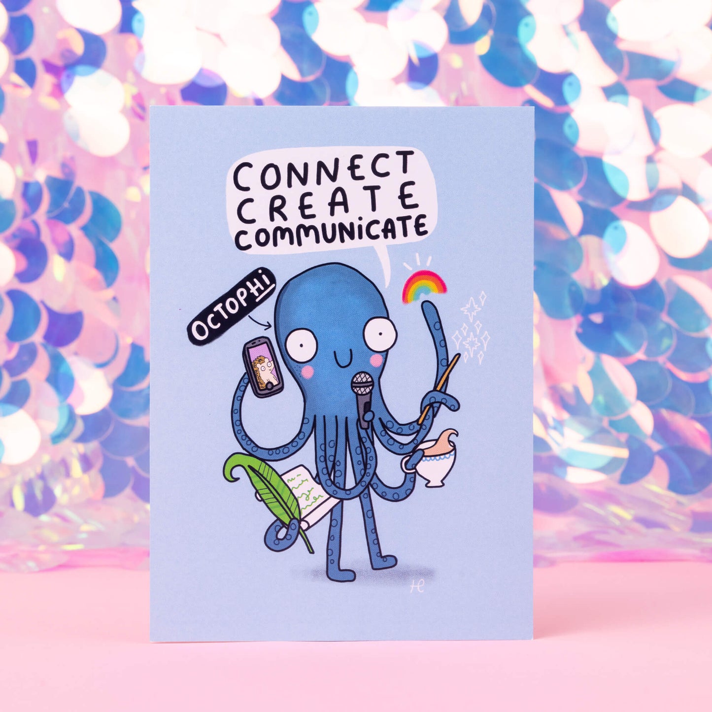 An illustration of an octopus with a phone, rainbow, quill and tea with text saying octophi Connect create communicate